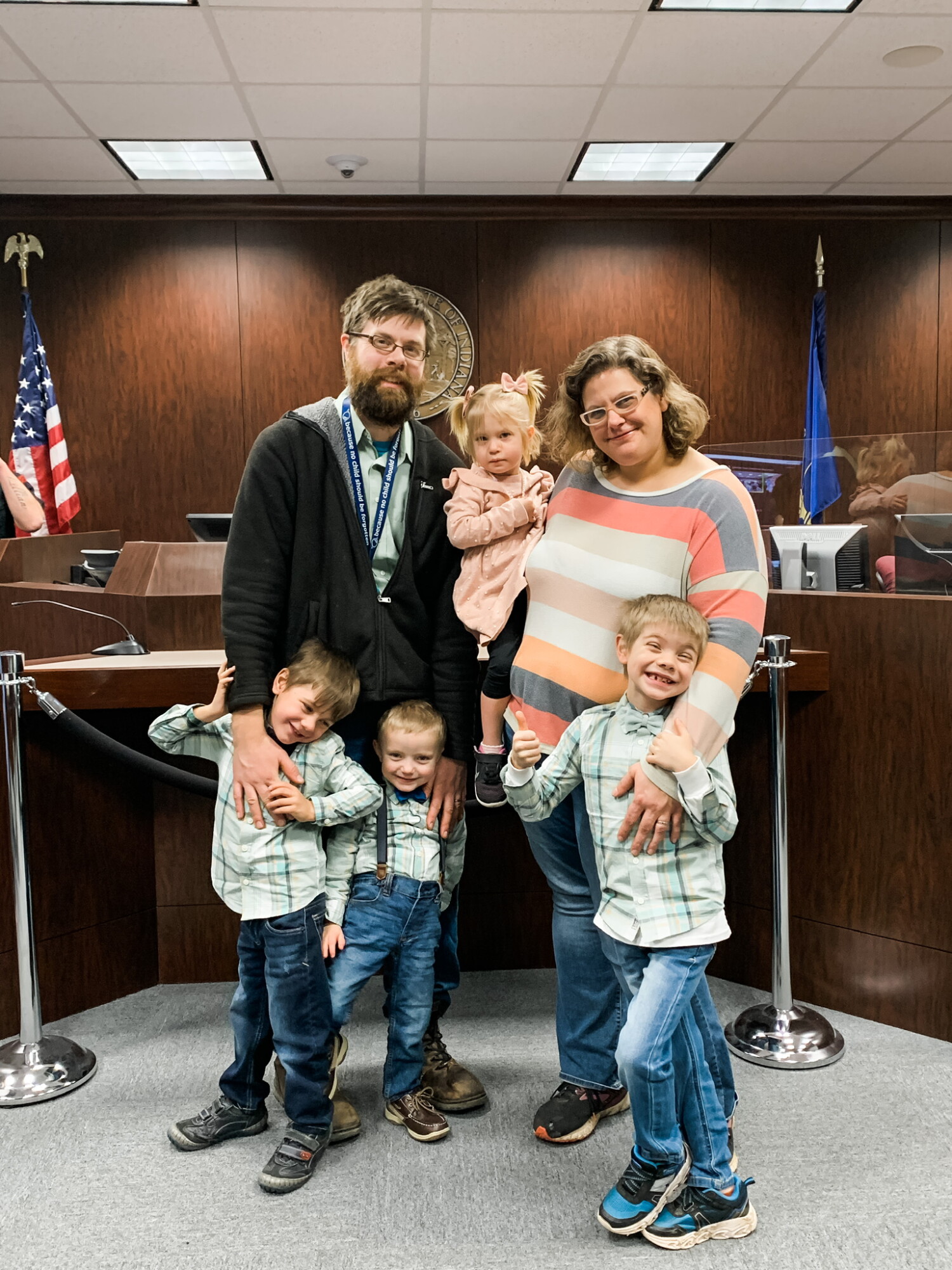 By the time our adoption photo was officially made, our kids had had seven case managers, four department lawyers, two adoption lawyers, plus one lawyer intervening on their behalf, four judges saw the hearings for their foster case, two judges did the adoption side of things, and the one constant besides us was their CASA volunteer!