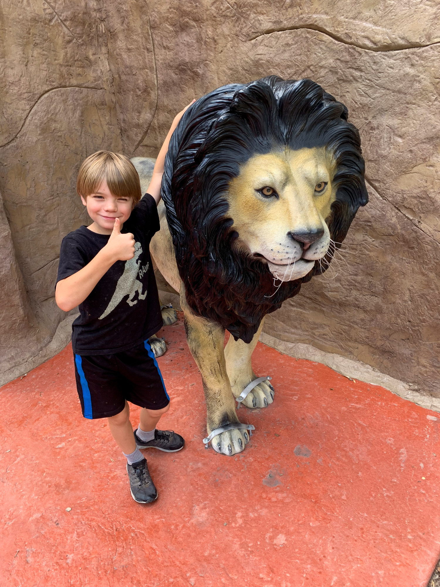 This life sized lion figure at the Washington Park Zoo is always a big hit with our kids!