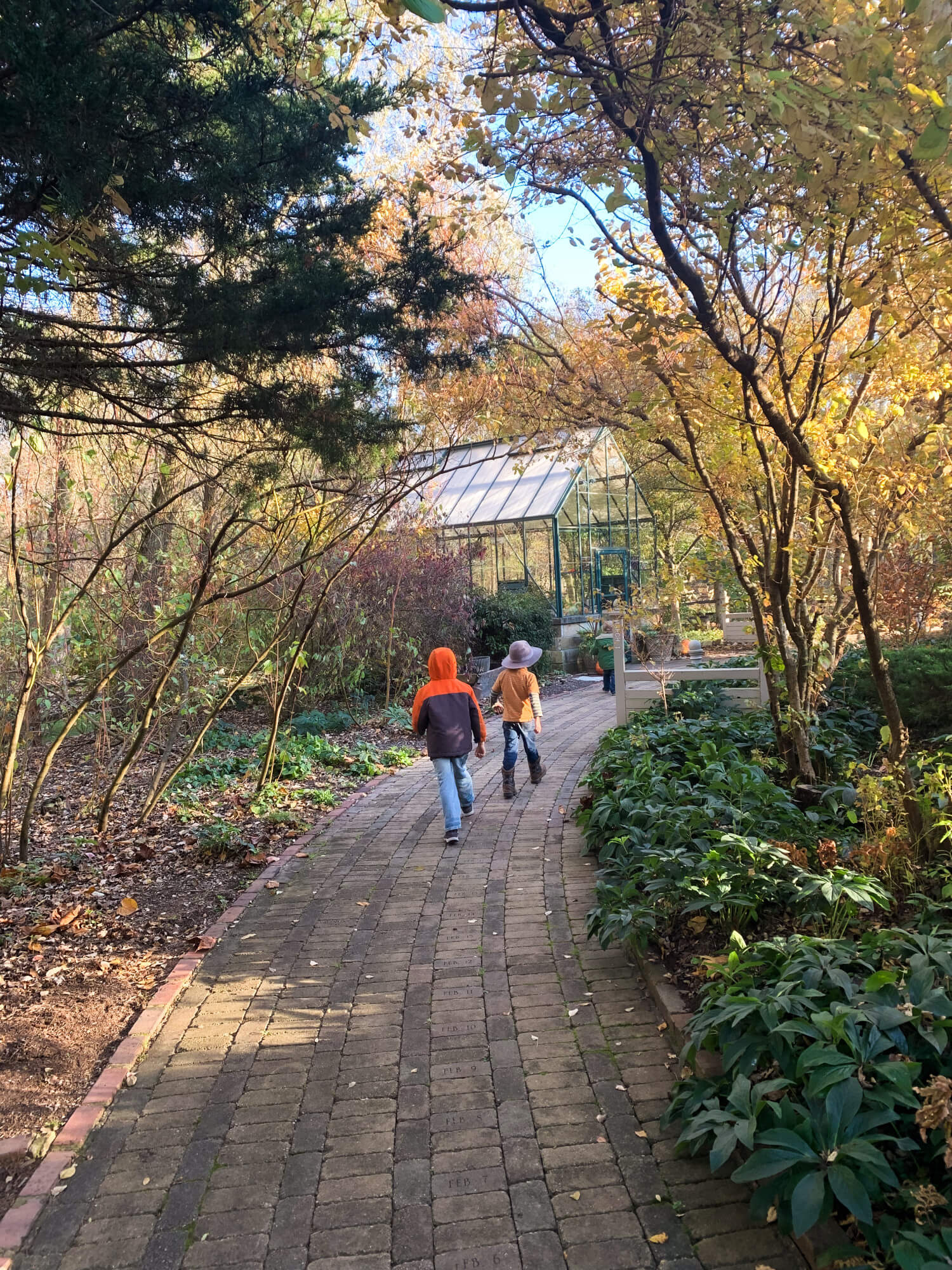 Our adventurous homeschool kids exploring the winter to spring section of the DeFries Calendar gardens. 