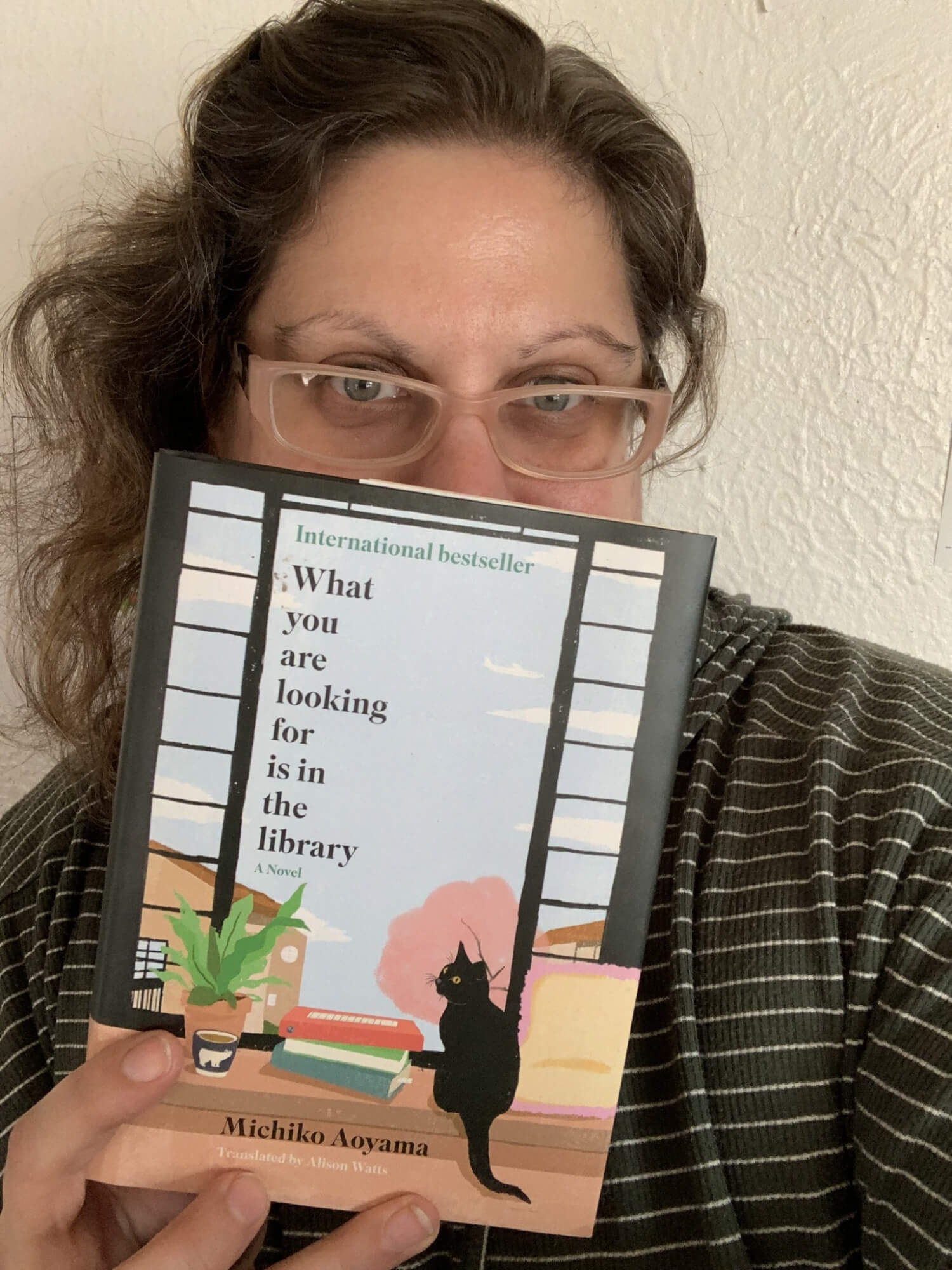 What you are looking for is in the library by Michiko Aoyama was the best book I read this January! I loved how each character in the short stories found their lives intertwined with the others. Charming & quick read!