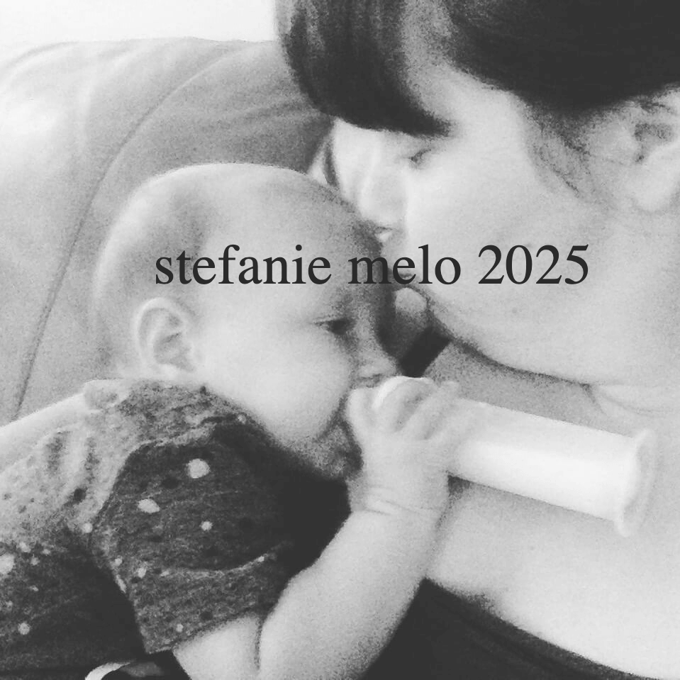  infant feeding with bottle, mom kissing property of Stefanie Melo all rights reserved