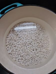 filling bean pot with water 