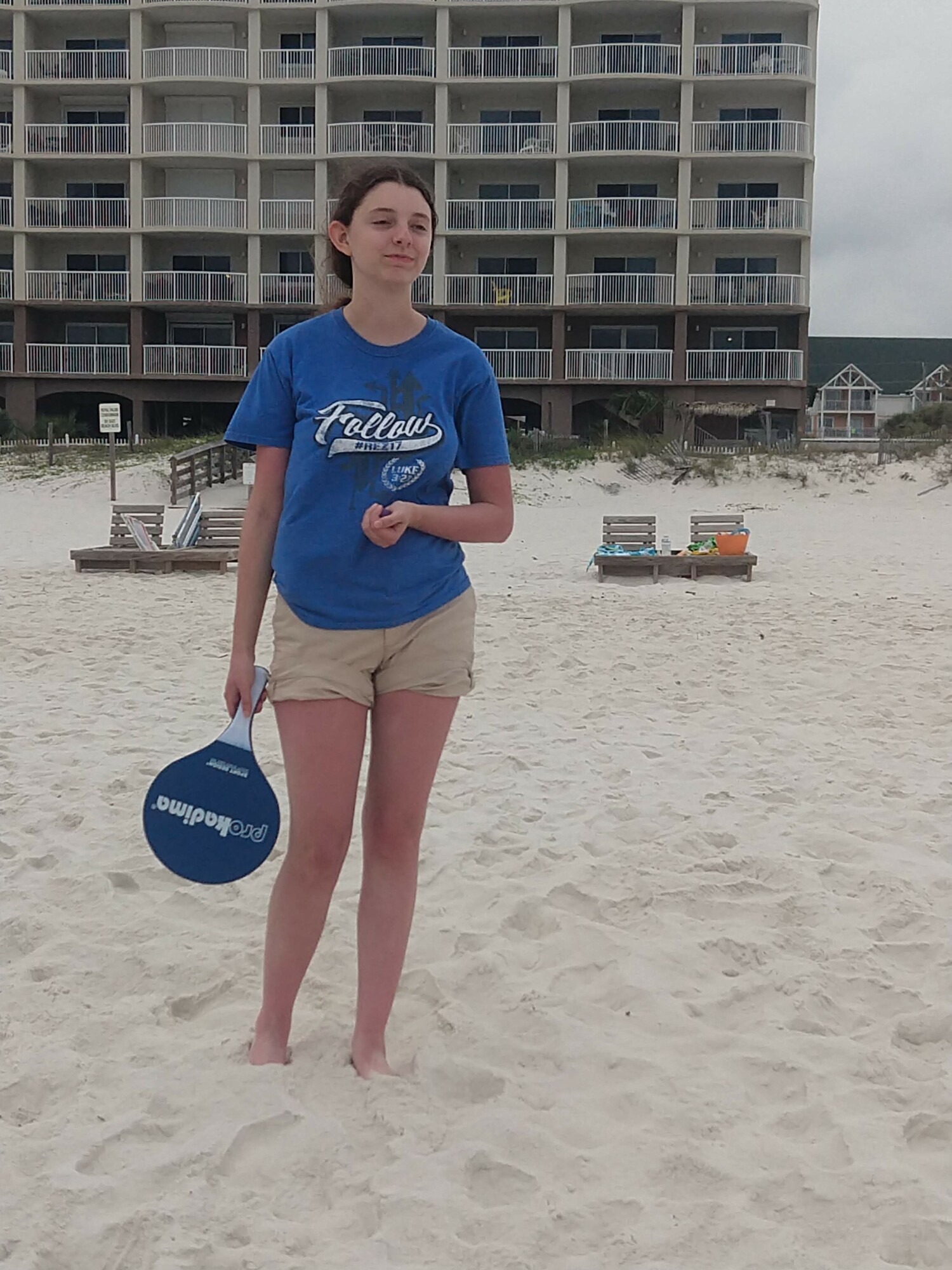 My daughter playing paddle tennis on the beach