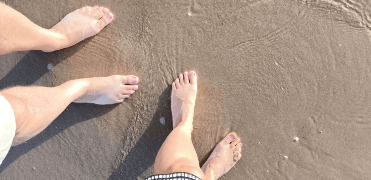  Walking barefoot on the beach with sunrise enjoying the feeling of grounding