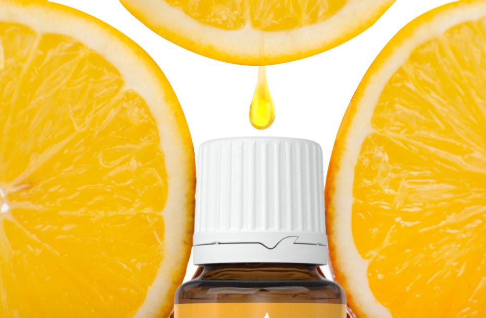 three slices of lemon with a fresh drop falling on top of a Young Living lemon essential oil bottle