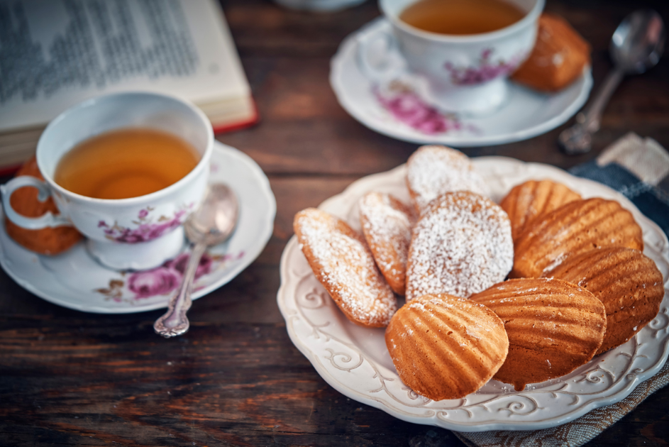 Plate of madeleine cakes by two cups of tea based on the science research by Marcel Proust for blog post for blog post Try This Simple Sensory Cue to Recall Vivid Memories!