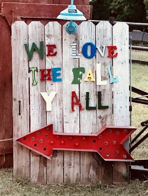 Wood vertical boards with We Love the Fall Yall and arrow for post Top 2 Ways to Celebrate Fall: Adventure and Reflection 