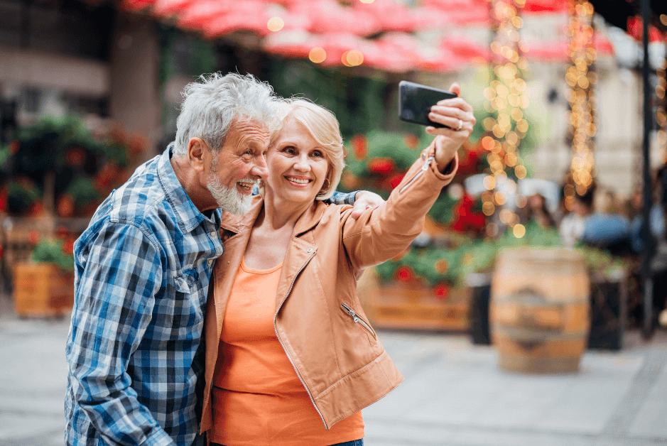 man and woman taking a selfie in a market place for post titled Journal Prompts to Unlock Creativity, Clarity, and Focus!