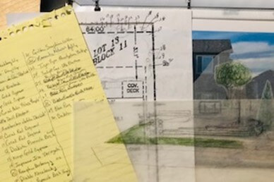 Plant notes on yellow note paper, house diagram, house photo, and tracing paper layout plan for post titled  Top 5 Reasons for Creating a Garden Journal