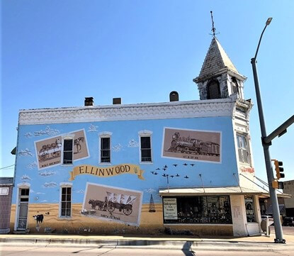 Mural on the side of the Ellinwood, KS antique store where the exploration begins for the latest Bound to Journal  post called Underground History, Mystery, and Curiosity-Inspired Journaling