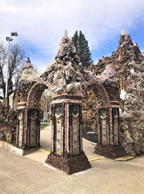 Entrance gate for the Grotto of Redemption for blog post titledAntique Postcard Sparks Sacred Grotto Journaling Adventure