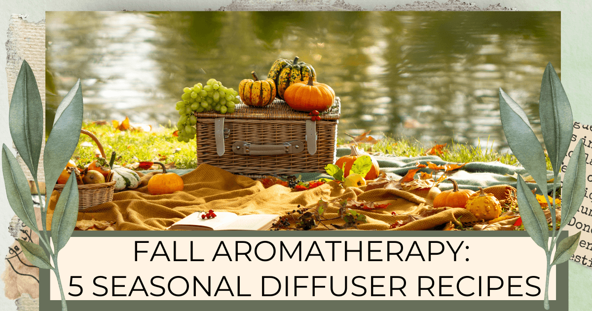 A picnic basket with pumpkins on top, sitting next to a stream on a blanket with fall leaves all around for a Bound to Journal blog post titled Fall Aromatherapy: 5 Seasonal Diffuser Recipes 