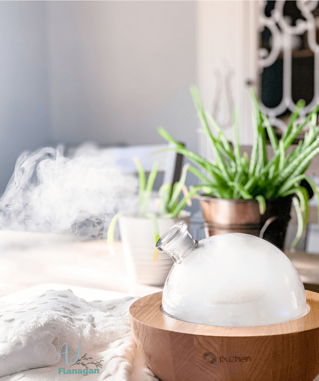 An aromatherapy diffuser in a light and airy room. 