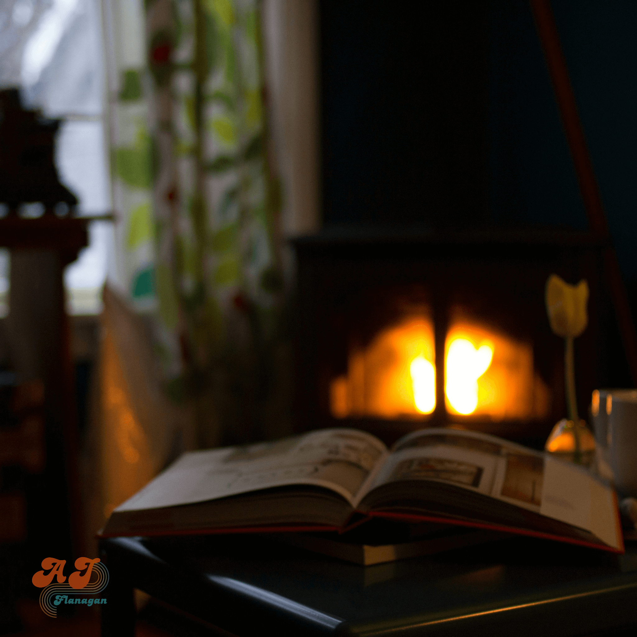  An open book by a cozy fireplace. 