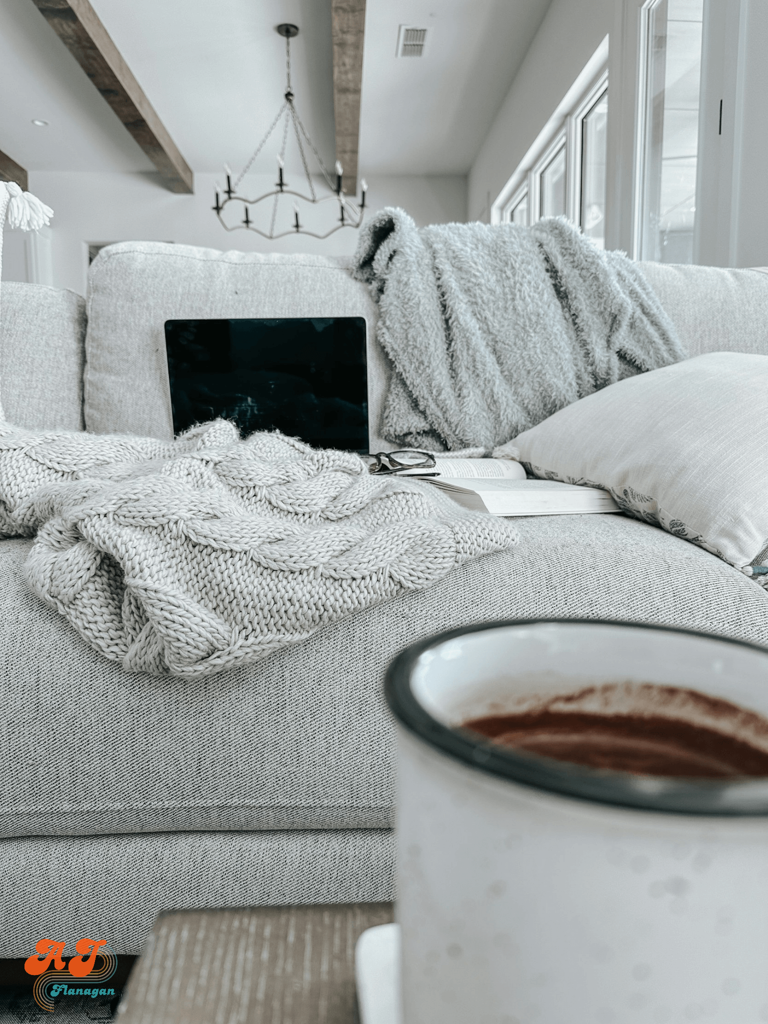  Hot cocoa by a sofa with a blanket; ready for a night in; cocooning