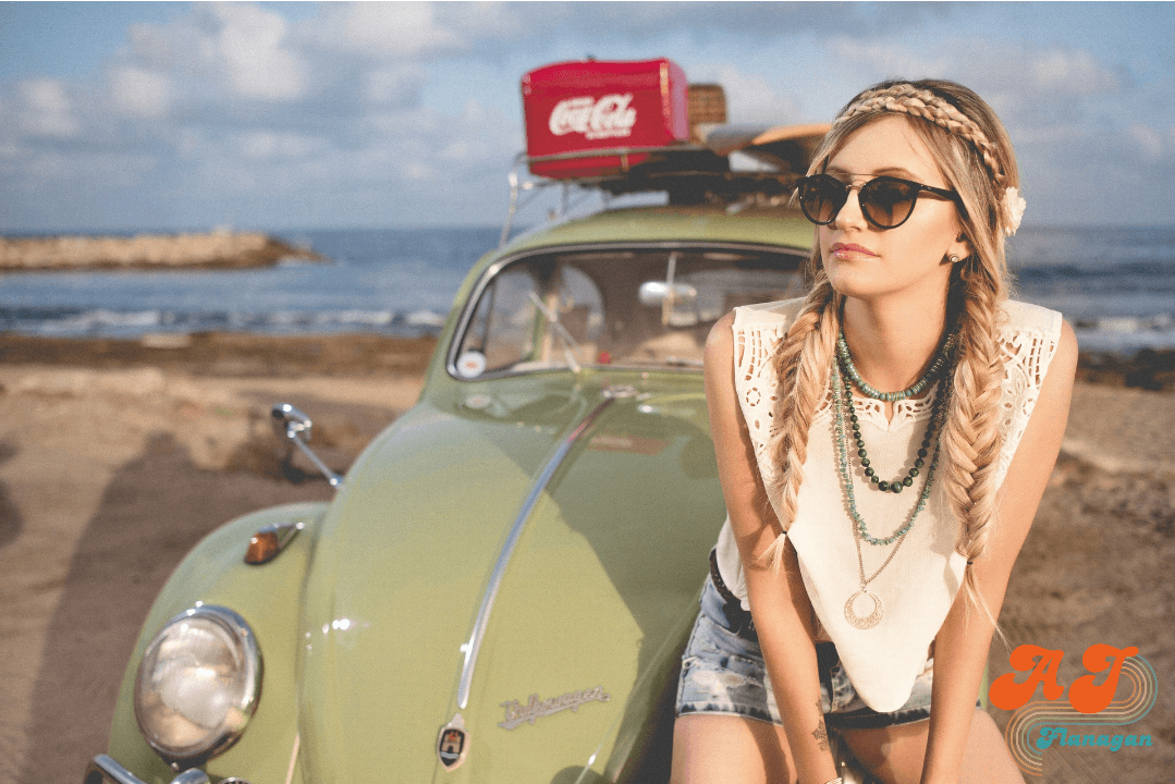 Solo Plans Aren’t a Betrayal; free spirit woman sitting on the hood of her vw beetle