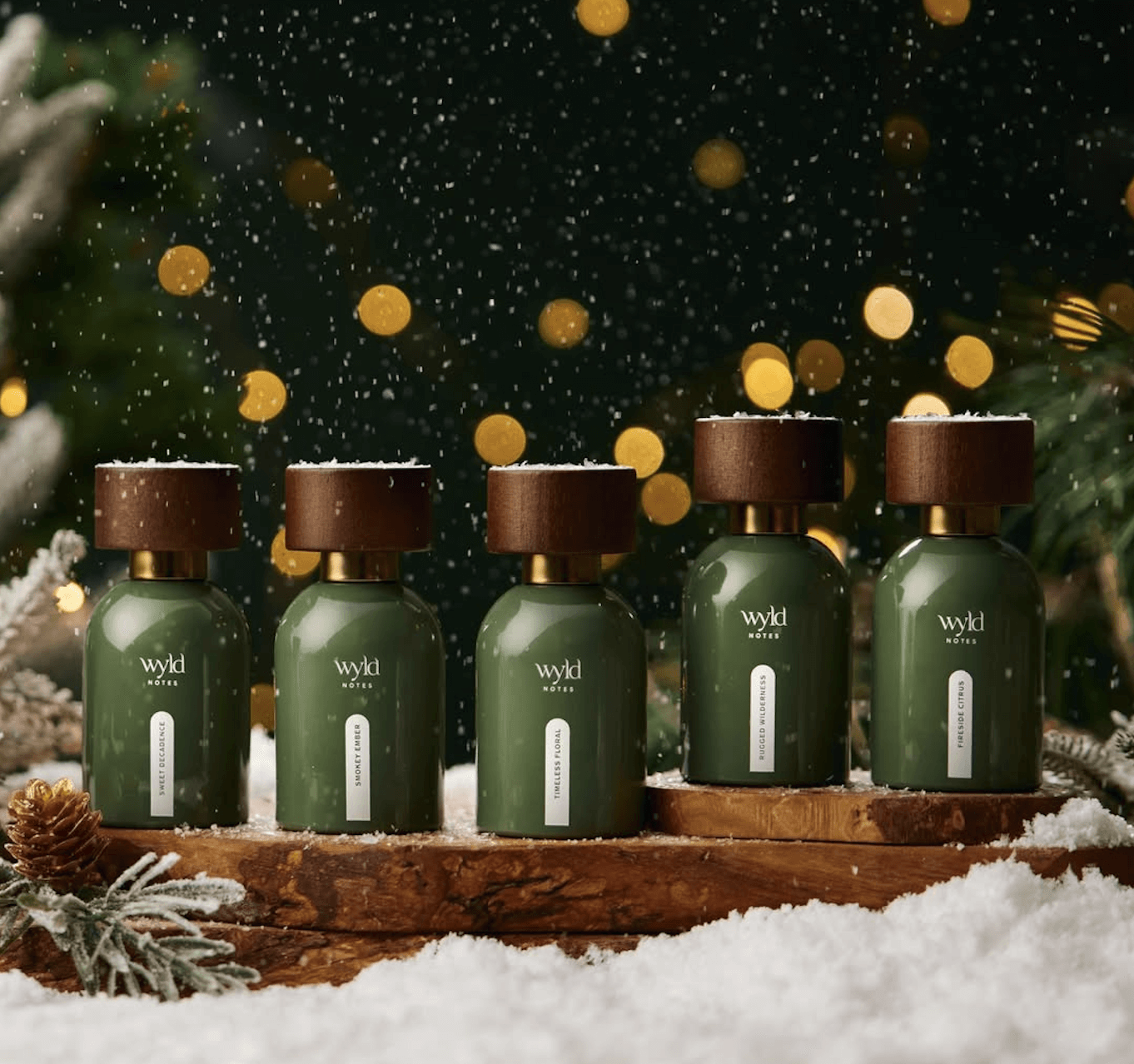  Wyld Notes™ botanical fine fragrance collection — clean, nontoxic perfume bottles displayed in a winter forest setting, curated on the House of Dawning Seasonal Wellness Shop.