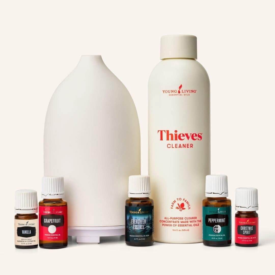 inter Starter Bundle — essential oils and Thieves® Cleaner arranged beside the diffuser for a simple winter home-care refresh.