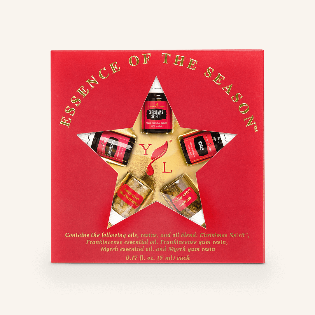  Young Living® Essence of the Season™ holiday essential oil collection — winter spice oils and resins displayed in a giftable seasonal set..
