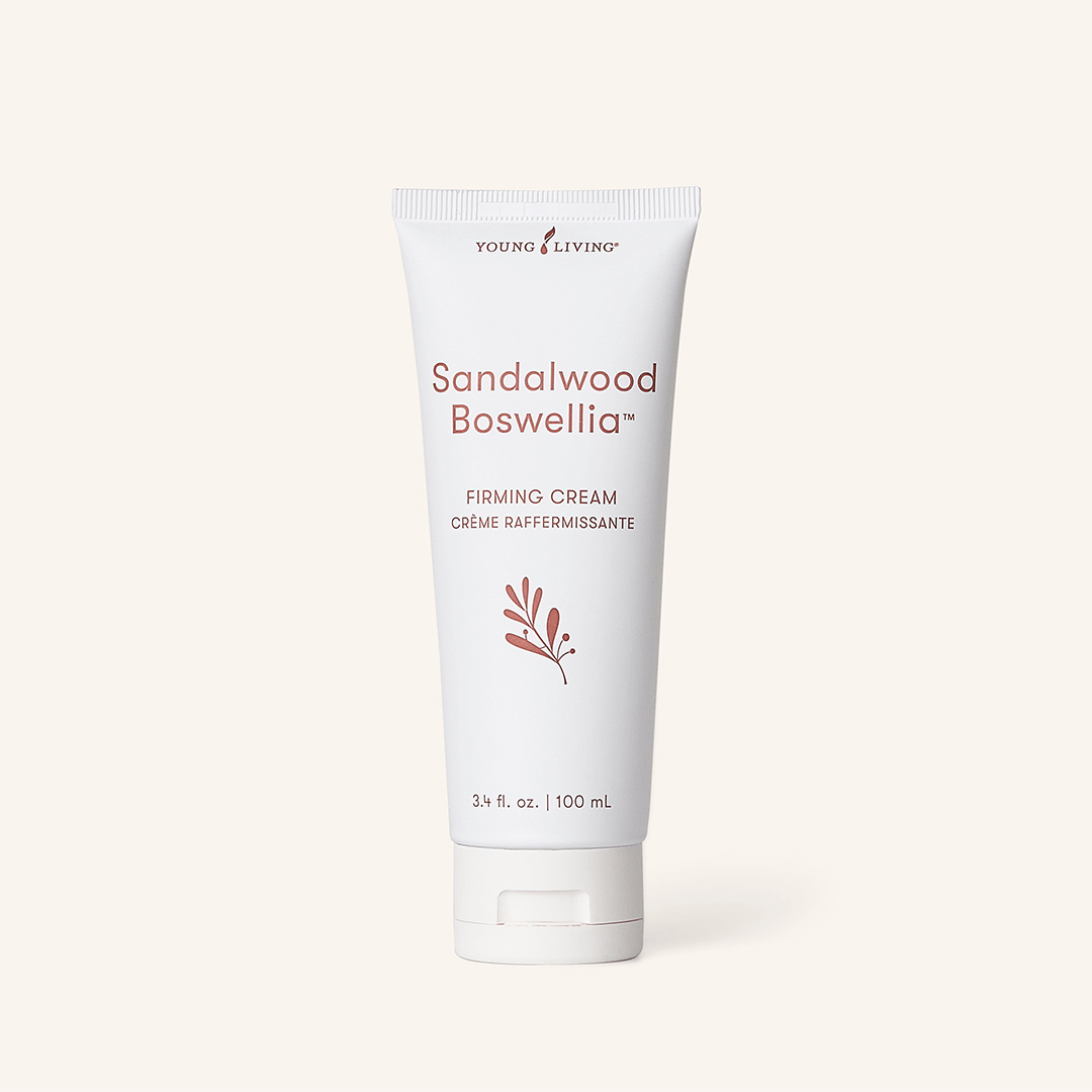 Young Living® Sandalwood Boswellia™ Firming Cream — hydrating botanical face cream photographed on neutral background.
