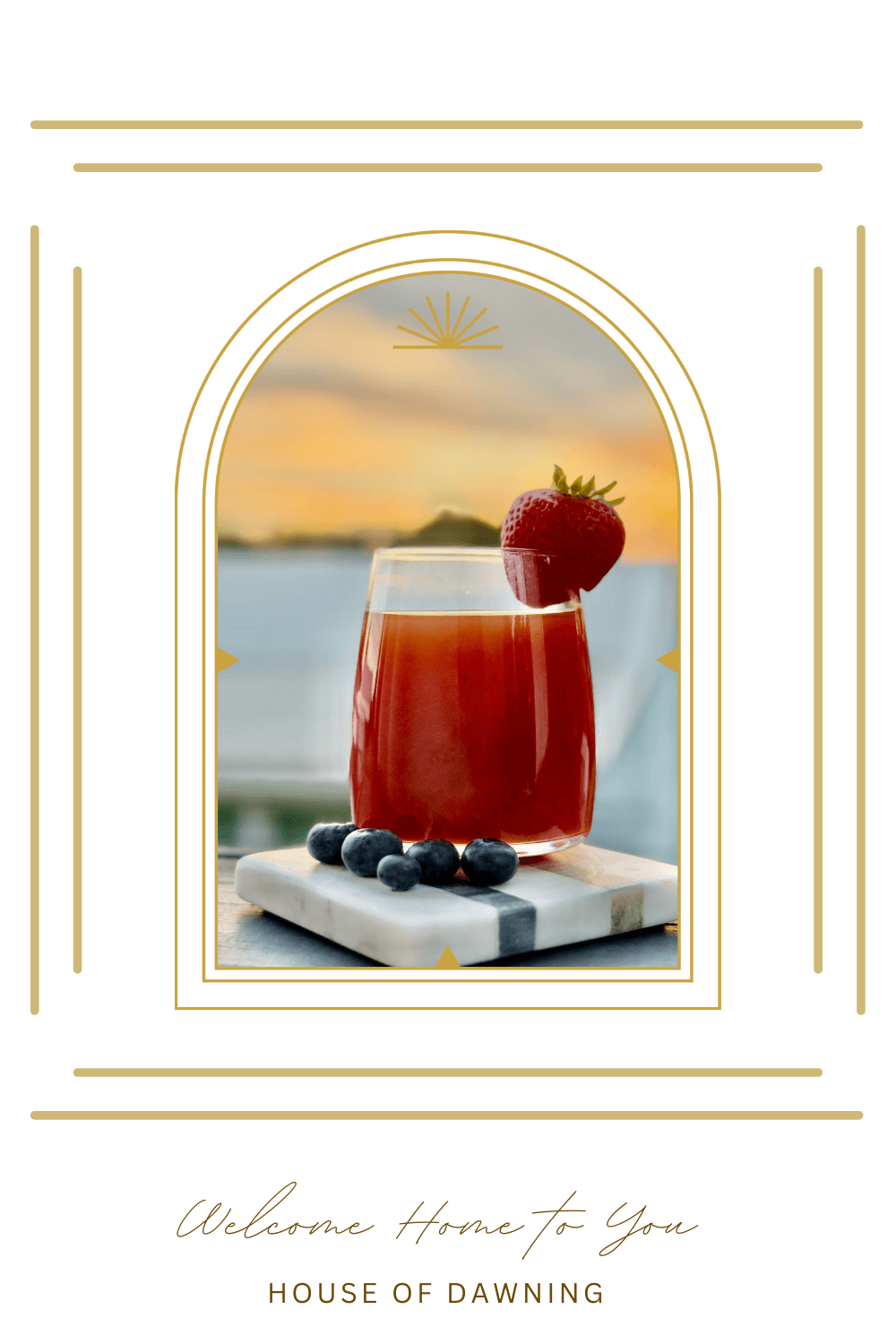 Glass of NingXia Red® with fresh blueberries and a strawberry garnish on a marble coaster at sunset styled to represent the Winter Rhythms 14-Day Reset and sunrise–sunset rituals at House of Dawning.
